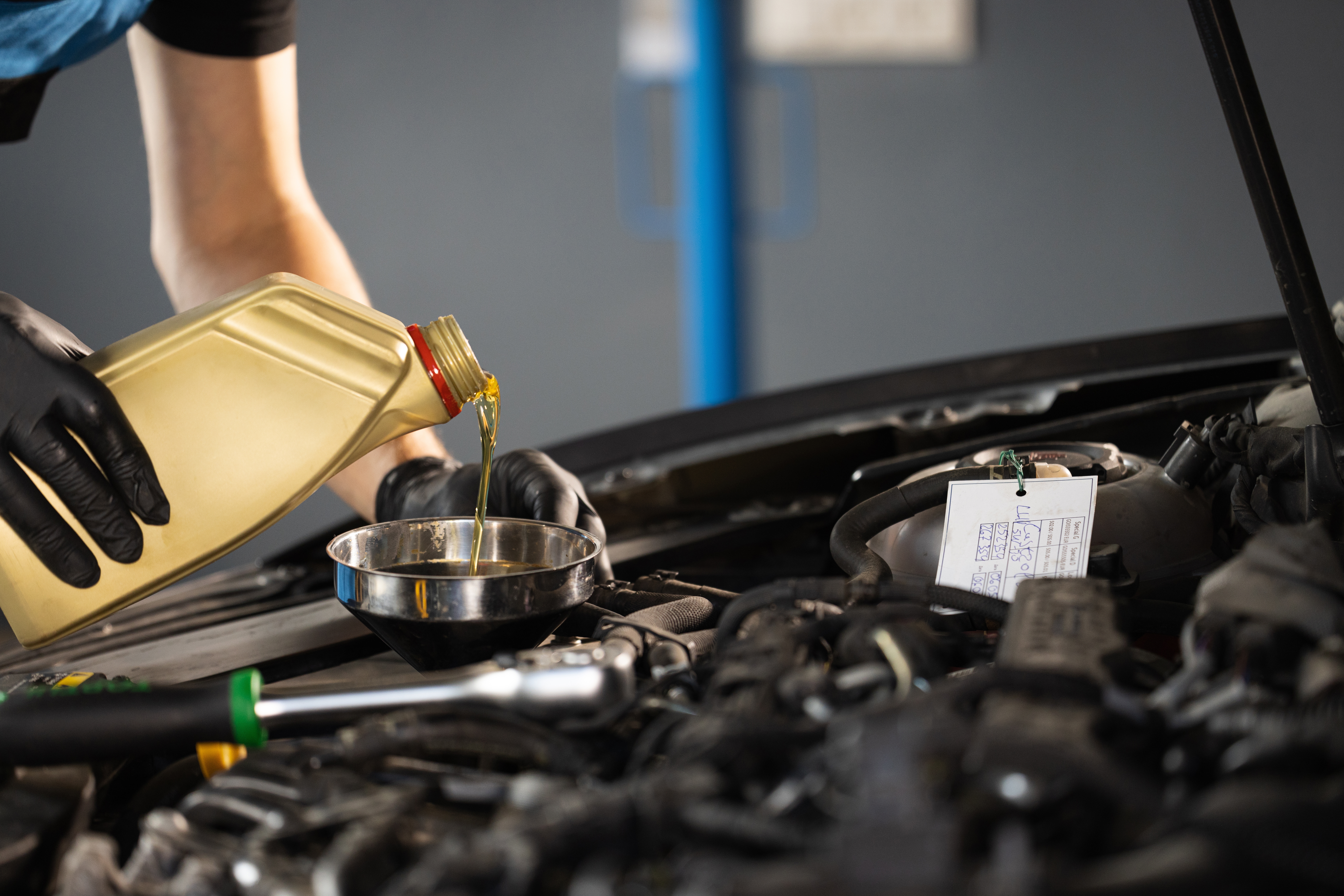 oil being poured into engine
